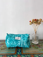 Neceser con motivos florales en tonos turquesa - Talla M